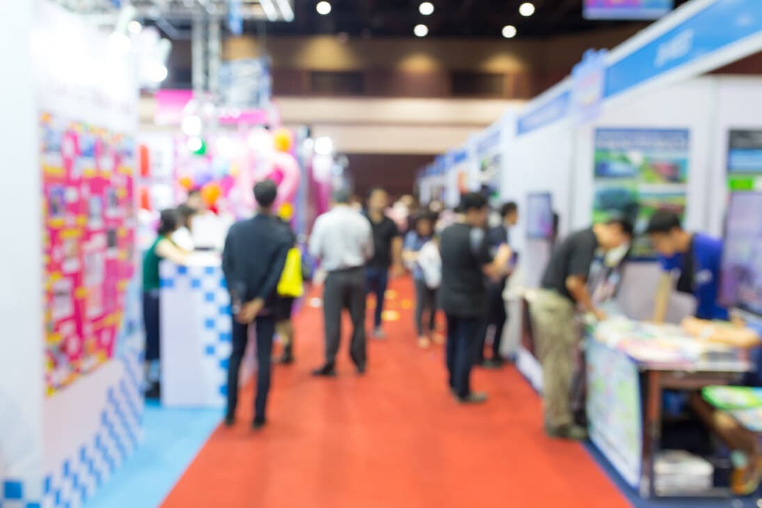 Attendees exploring a medical industry exhibition